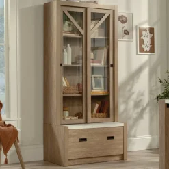 Sauder Dixon City Library 4-Shelf Bookcase With Sliding Doors And Filing Drawer, Brushed Oak/Pebble White